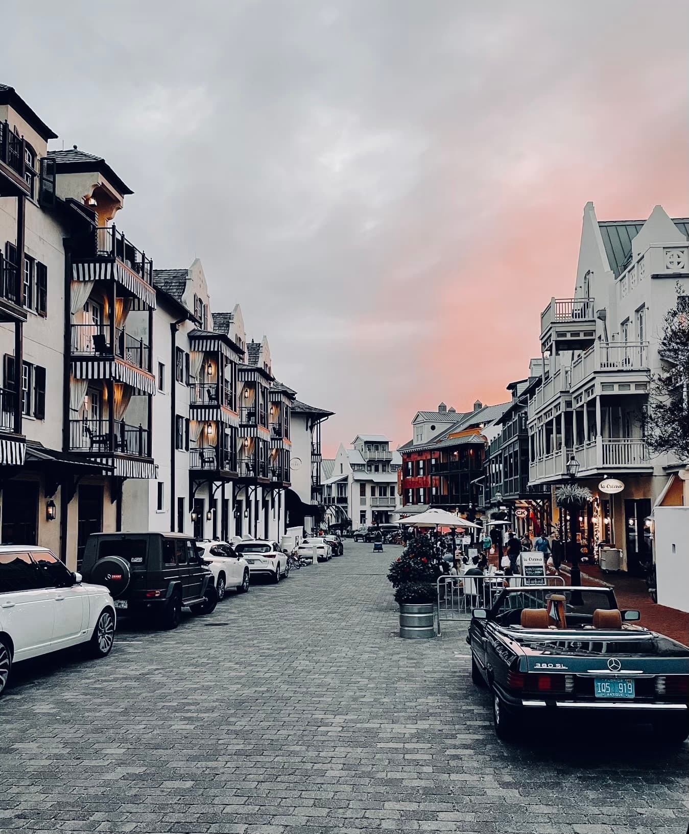 A wooden walk way to the beach with a view of the water