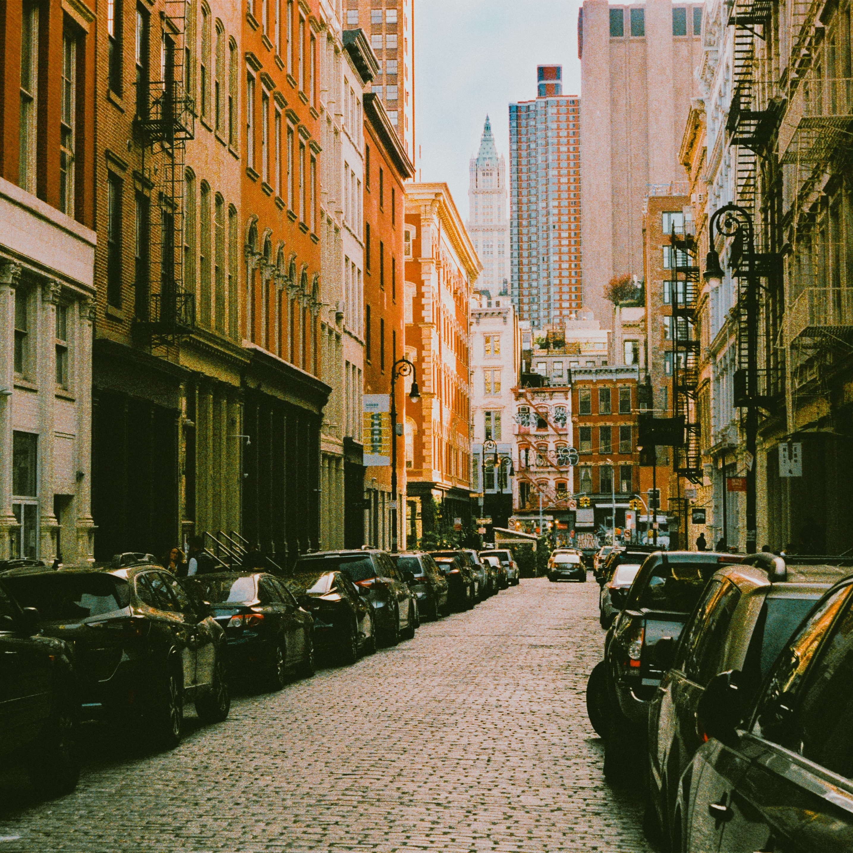 Close up of street in NYC on a shady day, causing dramatic lighting.