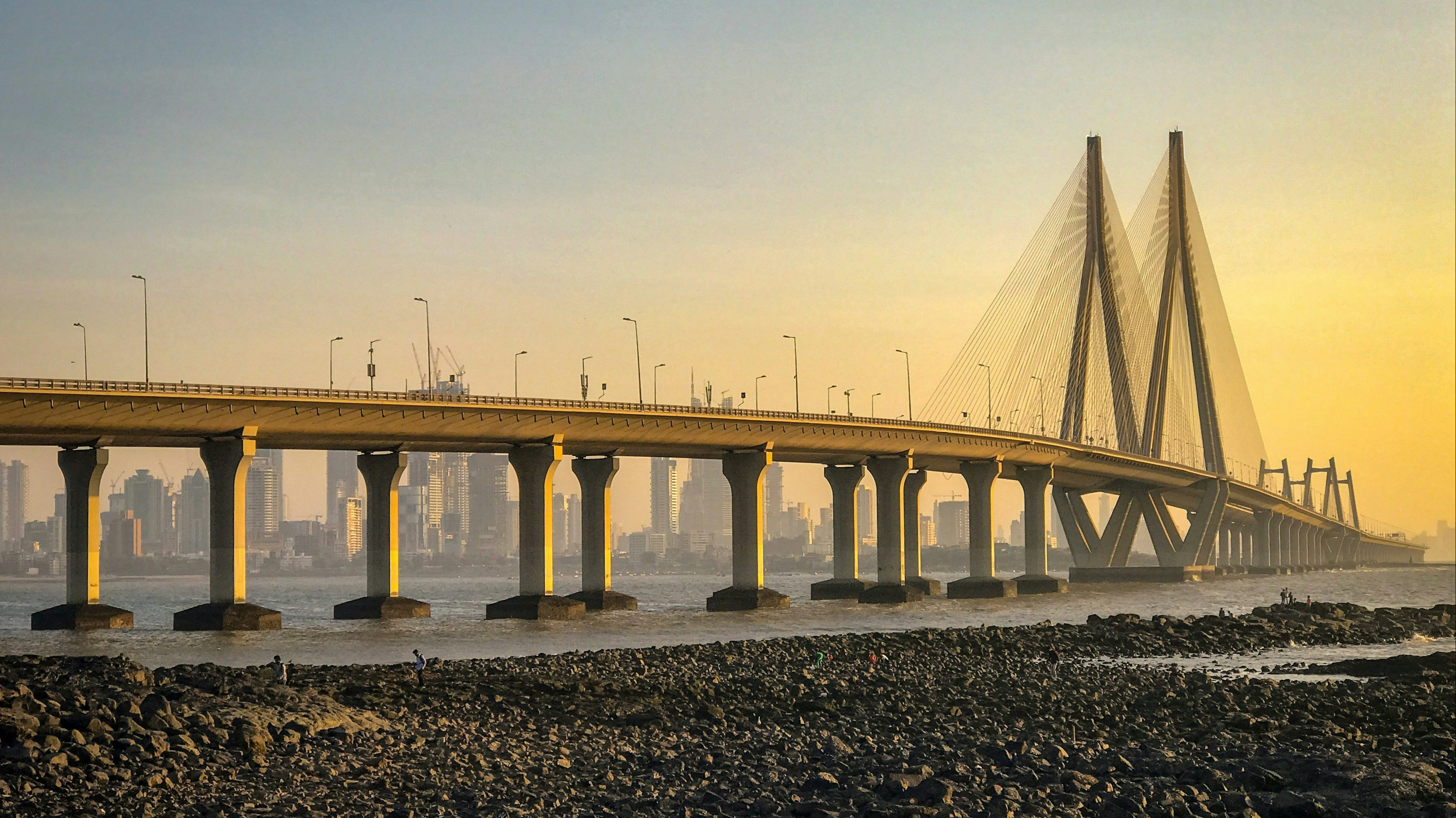 Bandra Worli Sea Link bridge in Mumbai over the water at sunrise.