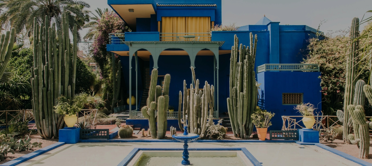 blue building with a desert courtyard