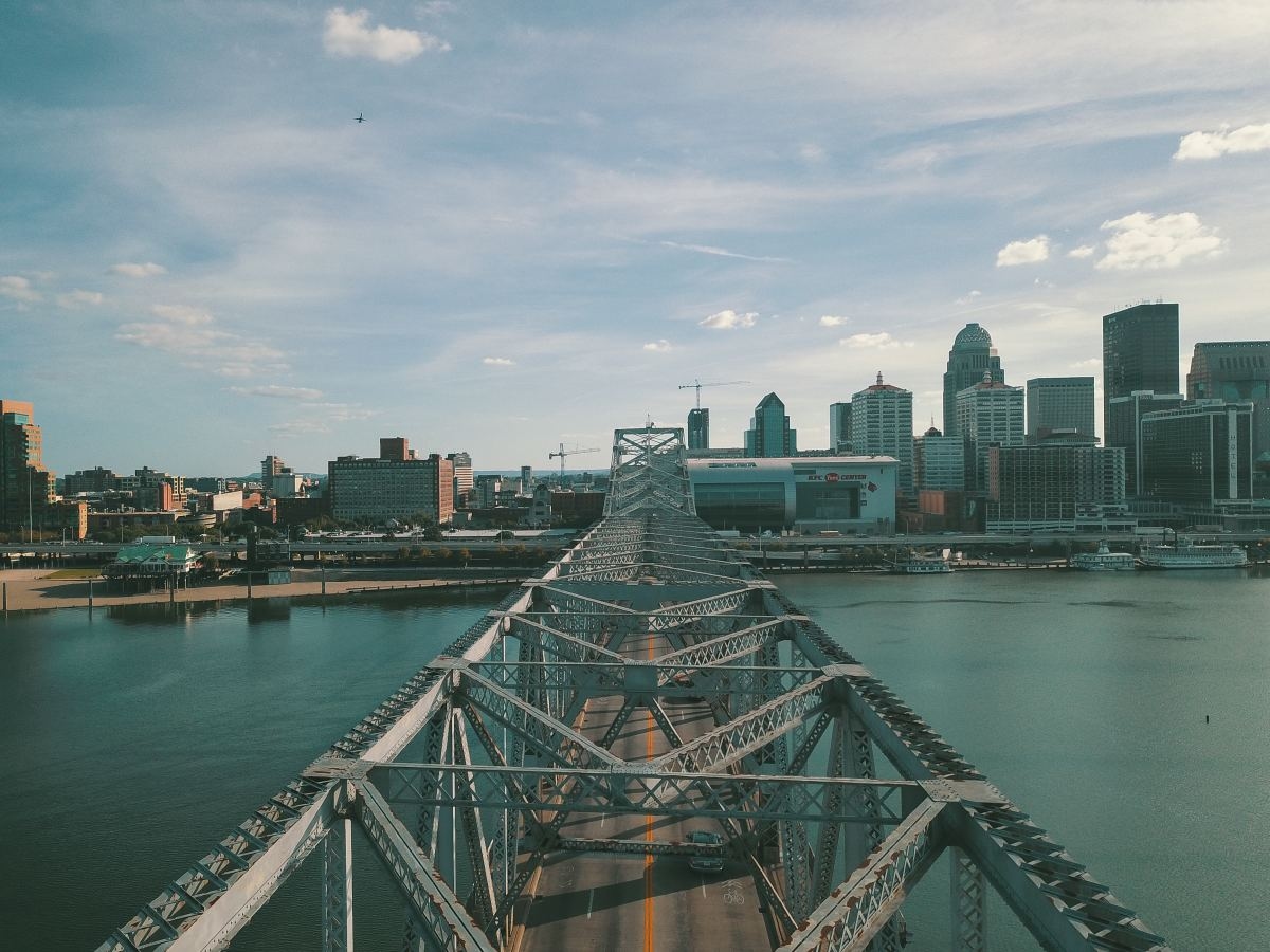 Grey concrete bridge above a body of water