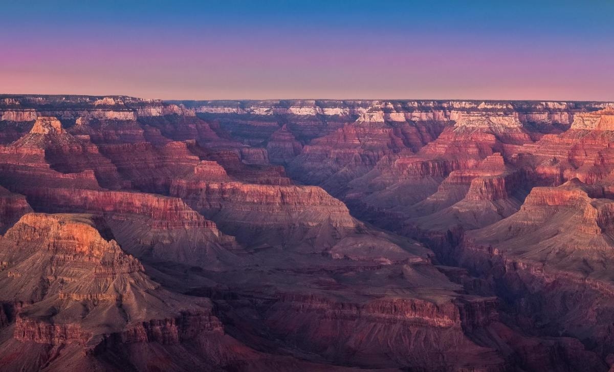 Grand Canyon during purple and red sunset.