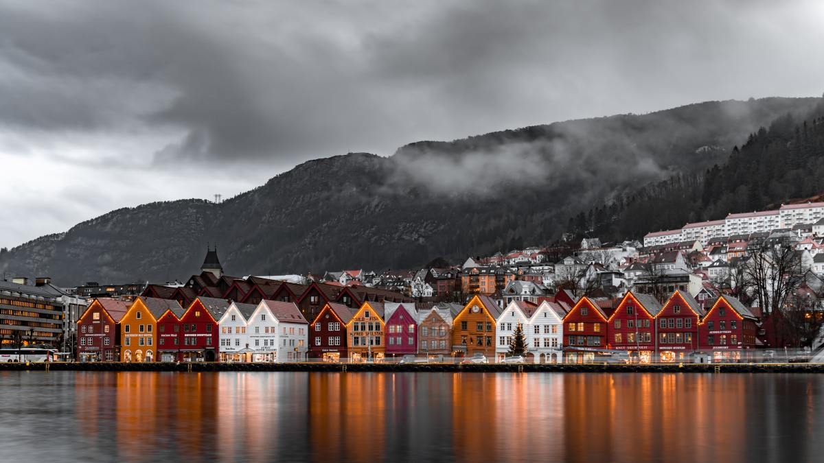 Historic buildings with holiday lights during cozy winter in Norway.