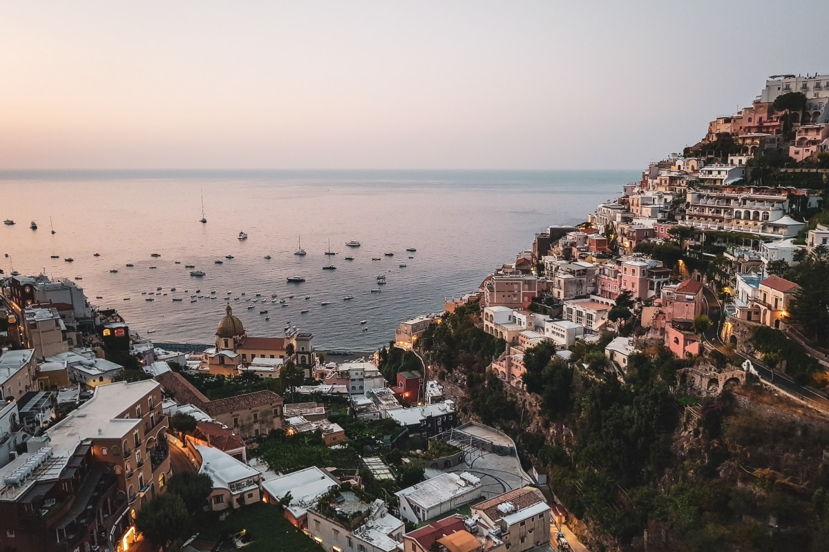 hilltop village overlooking the sea at dusk