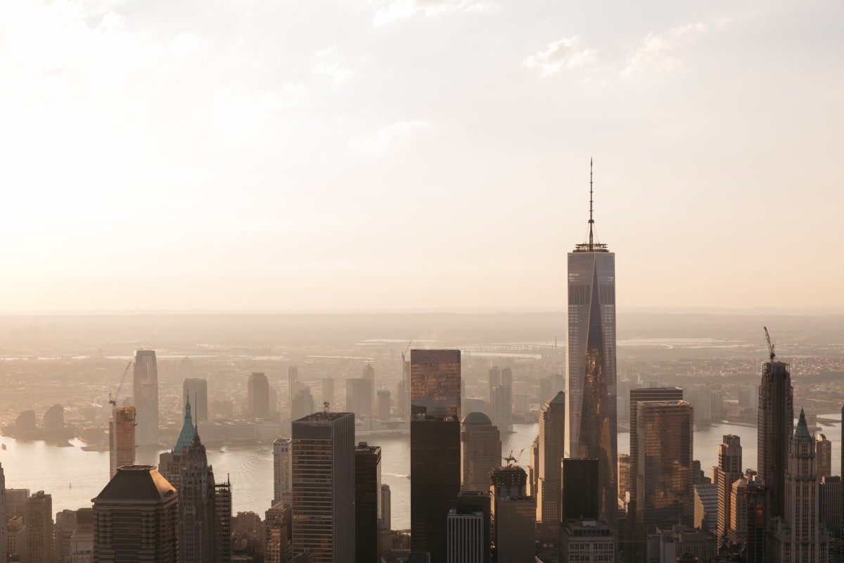 New York City skyline with the Freedom Tower and Hudson River.