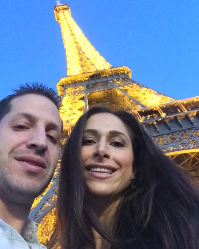 Couple posing with a tower view