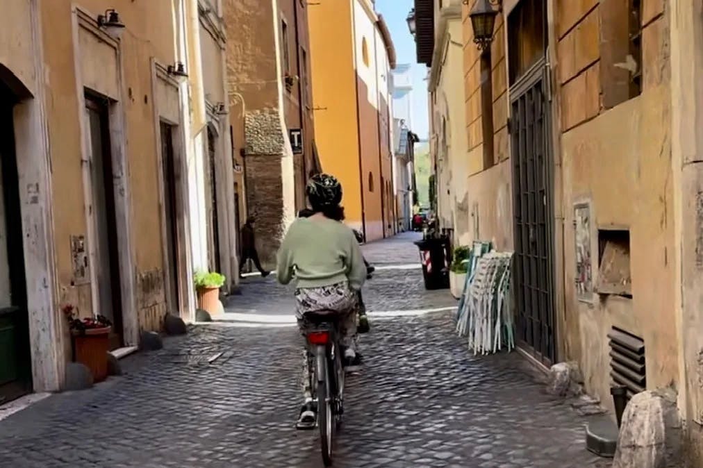 a-person-on-a-bike-rome-travel-guide