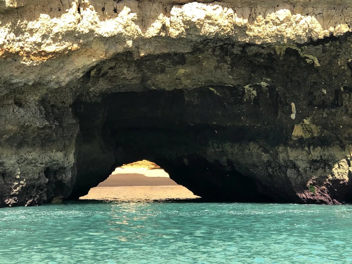 A cave above a body of water