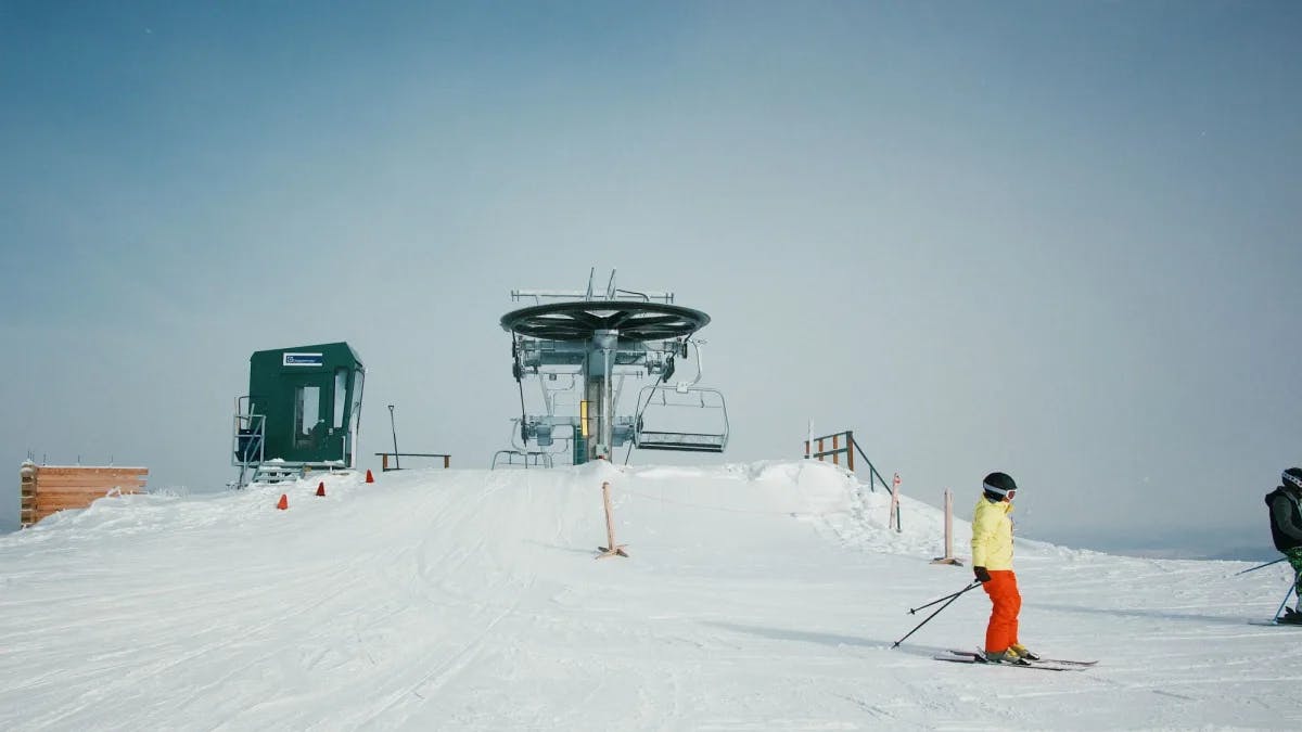 People wearing snow ski gears during day time.