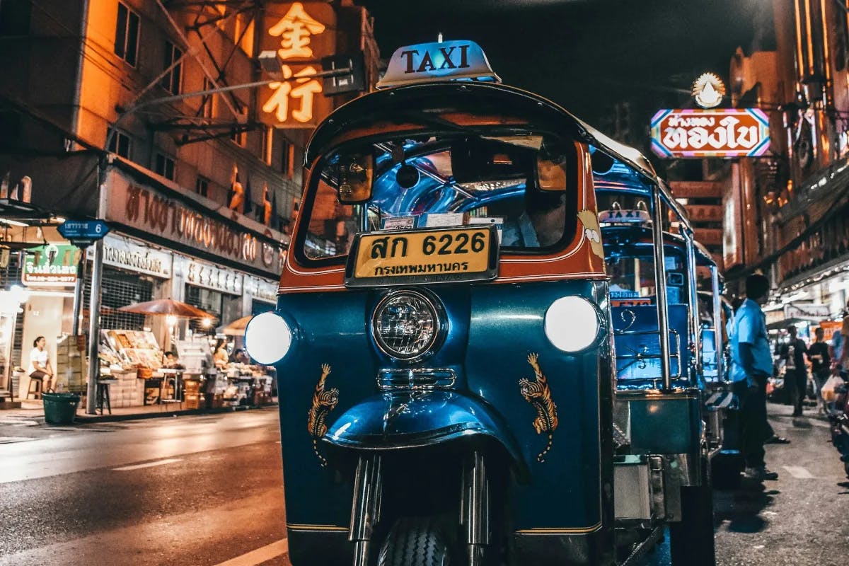 A blue auto rickshaw is your ride in Thailand.