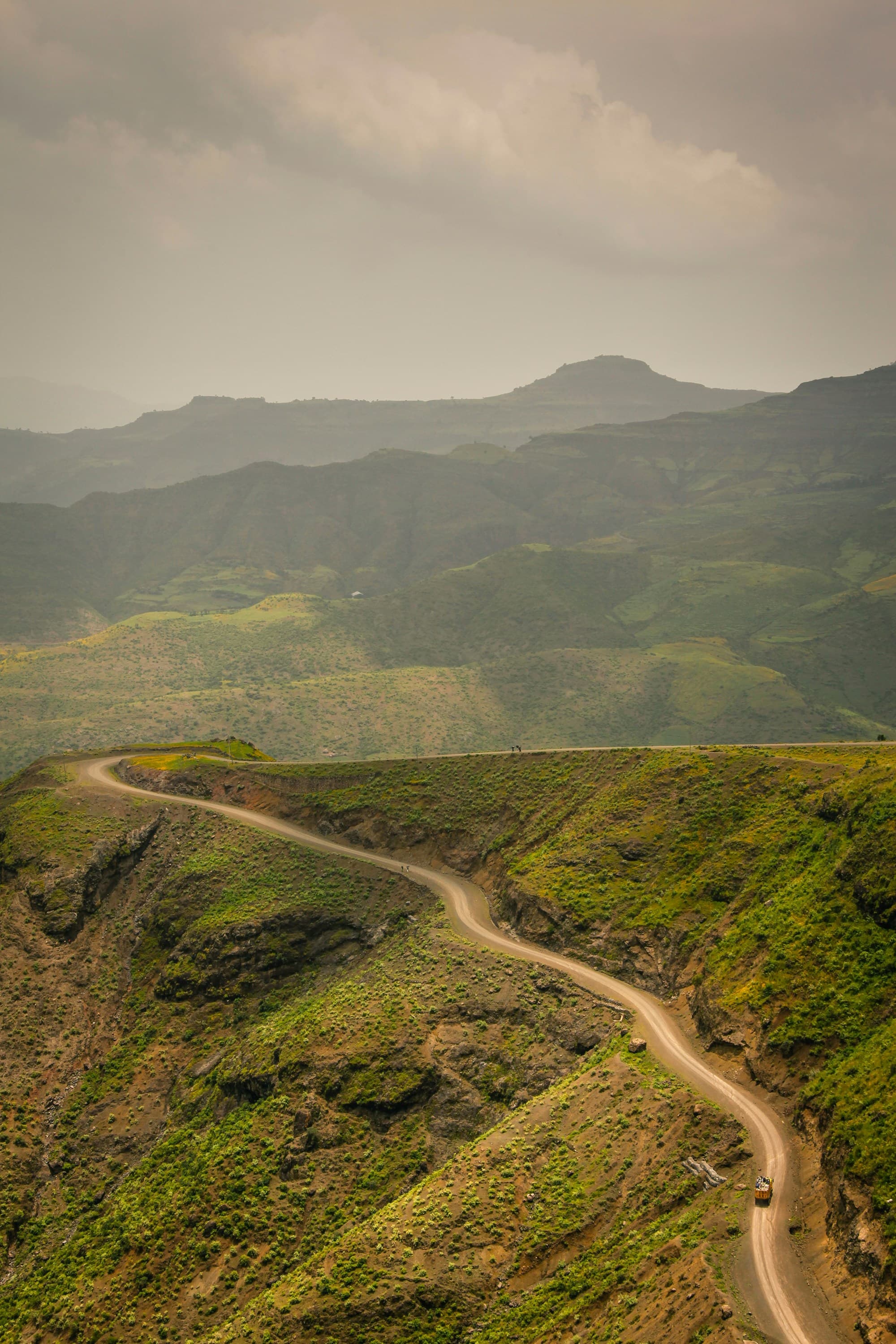 A hillside road during a hazy day