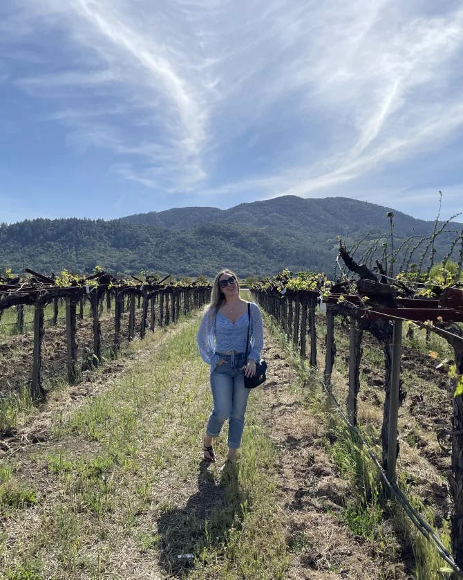 Picture of Kalie in vineyard