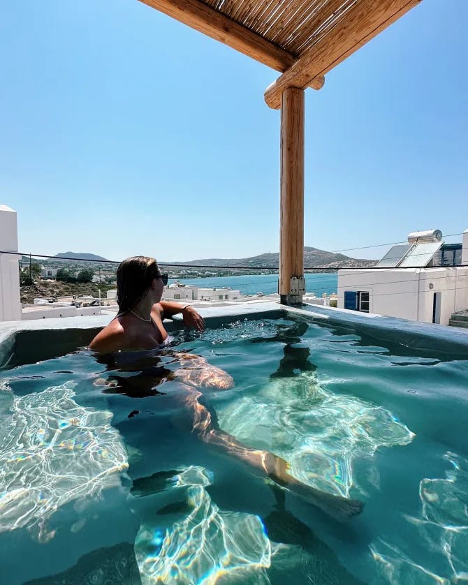 Travel advisor posing in a pool