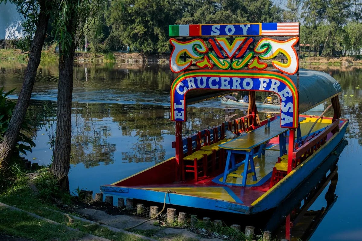 A boat on the water with a colorful sign