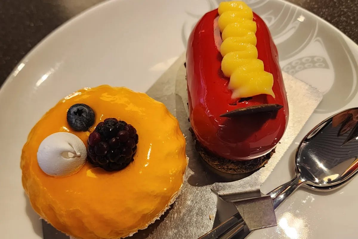 A picture of dessert served on a plate with a spoon.