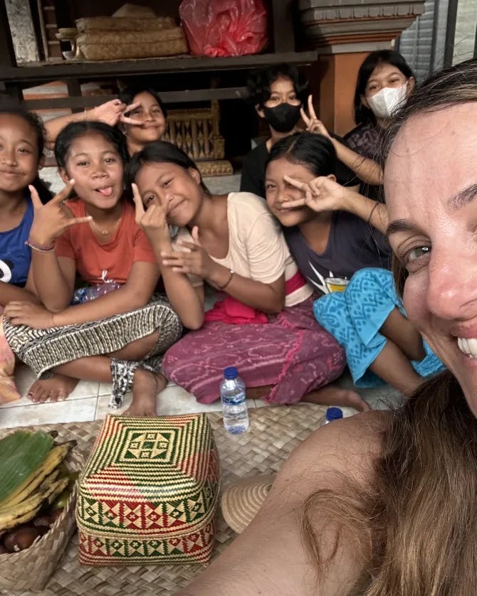 Travel advisor posing with a group of kids