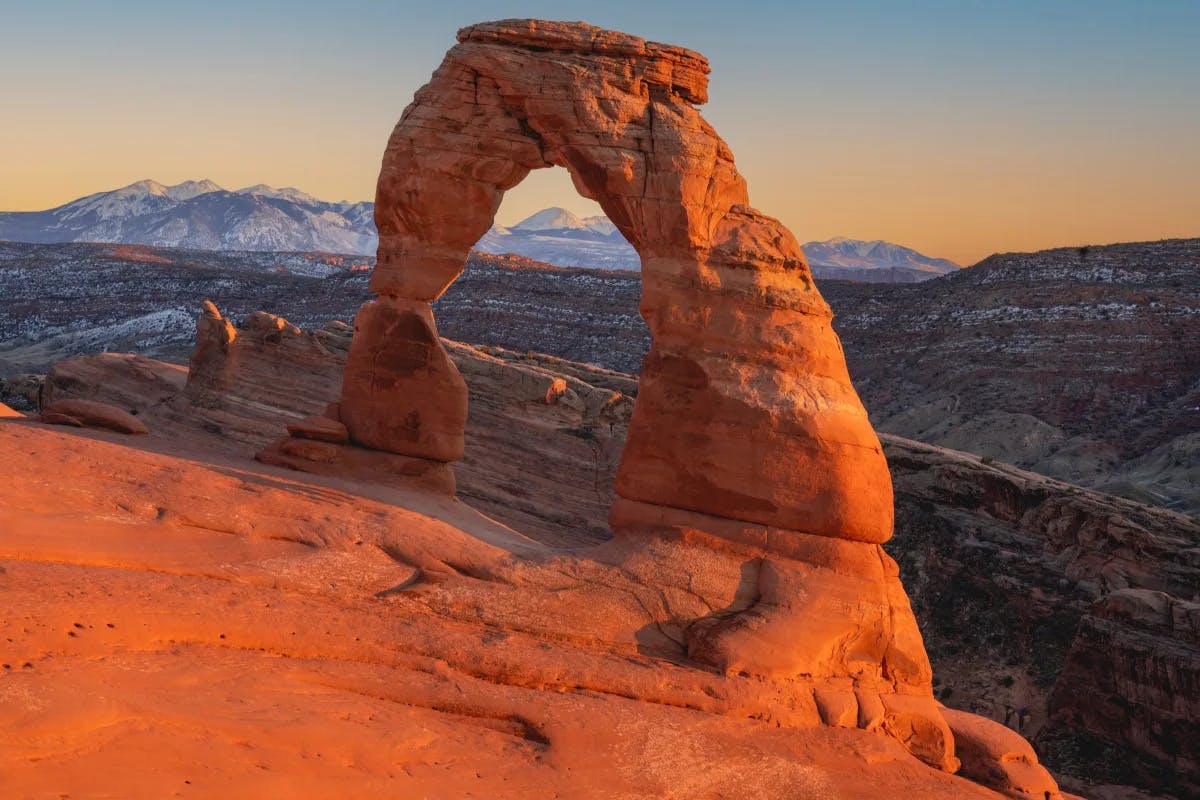 Delicate Arch is a 52-foot-tall freestanding natural arch located in Arches National Park.