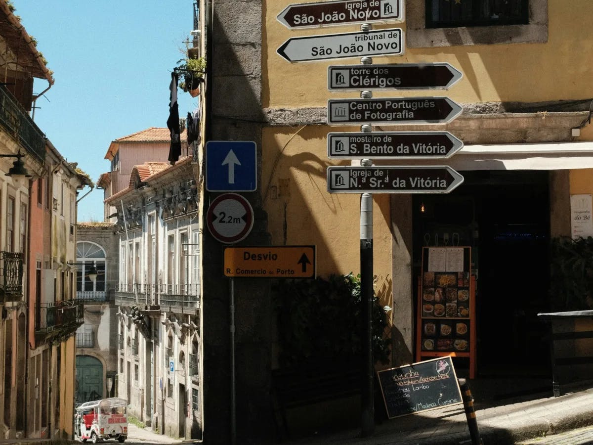 A city street with a group of road signs
