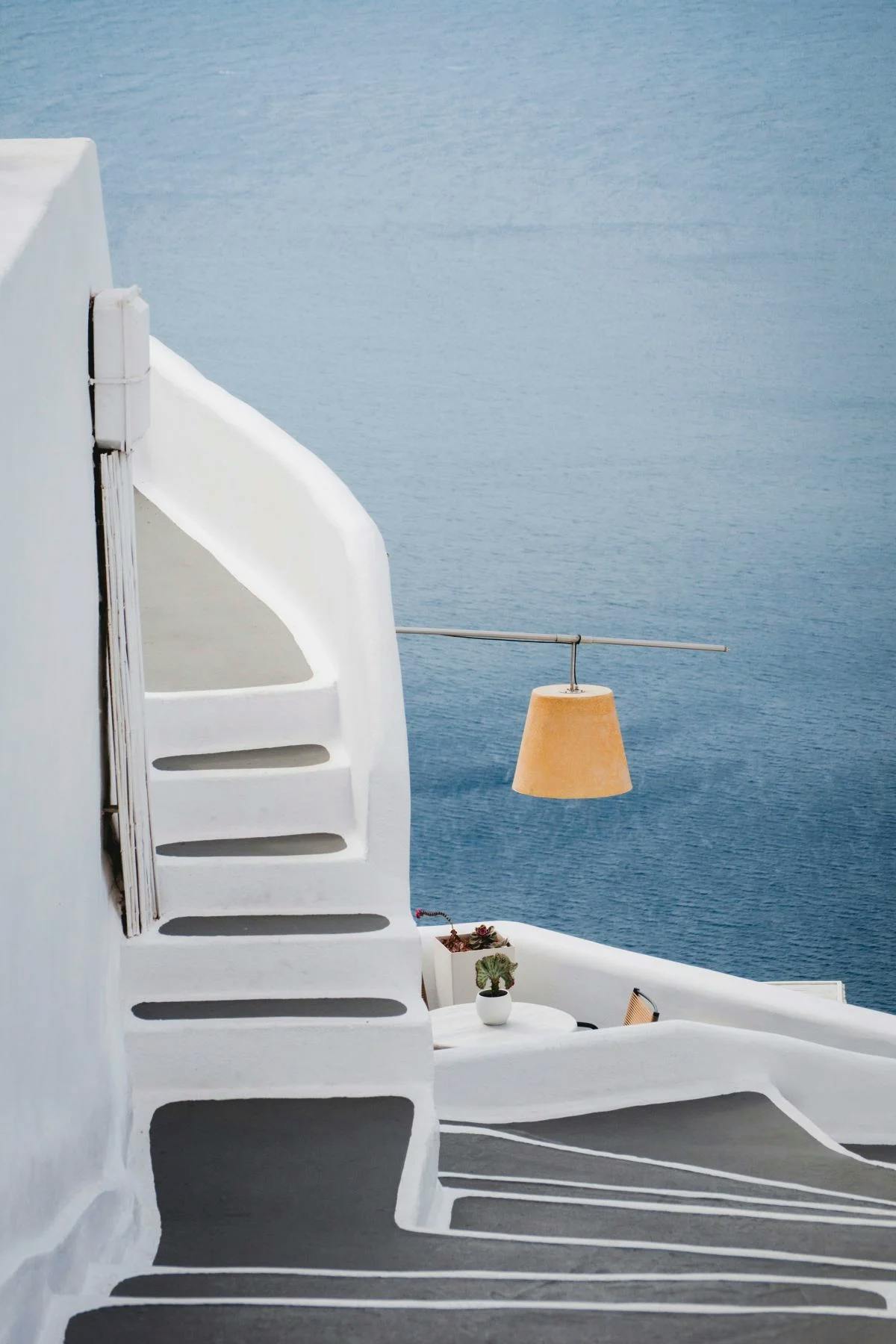 white staircase overlooking the sea