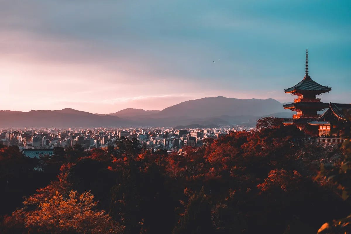 A pagoda overlooking Kyoto in Japan with fall colors.