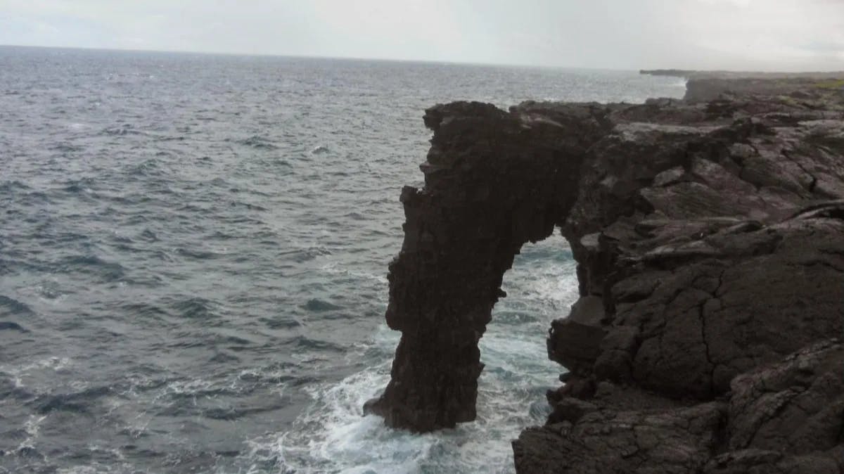 Ocean with a rocky cliff. 