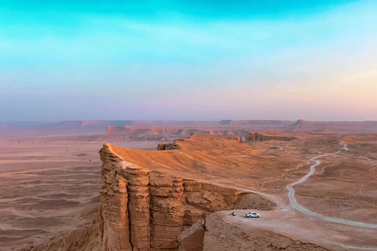 An aerial view of a dessert at sunrise.