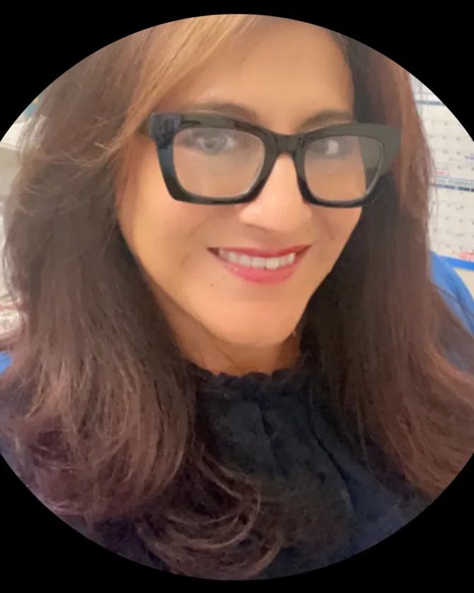 Travel advisor Lisa wearing black top and glasses