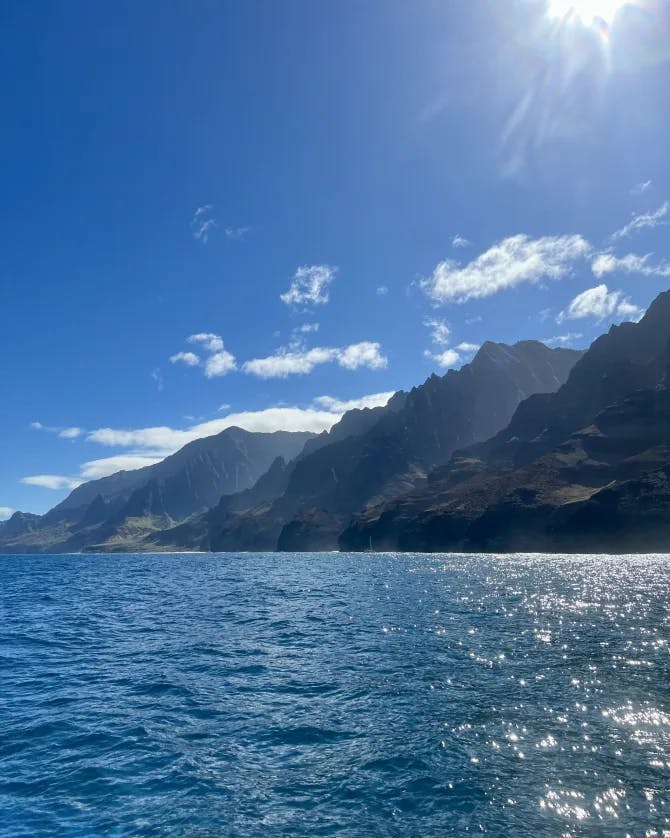 clear blue water and mountains