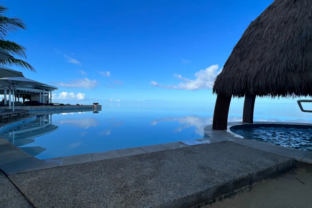 Aerial-view-of-hut-near-beach-fiji-travel-guide