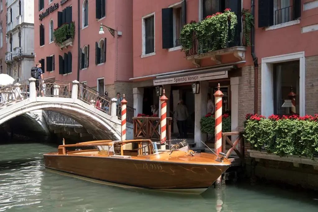A wooden river boat awaits guests of Splendid Venice - Starhotels Collezione to embark on a canal tour