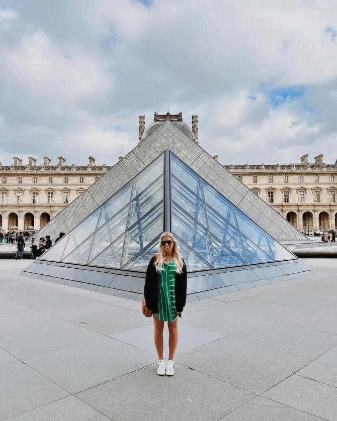 Travel advisor standing in front of a building