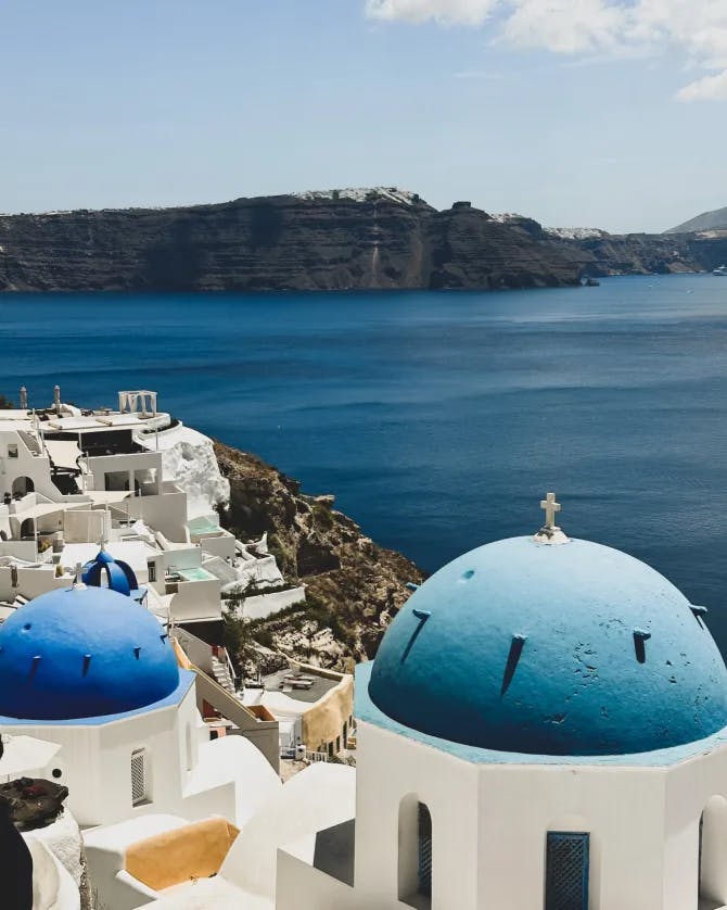 Santorini's stunning cliffs and blue-domed beauty