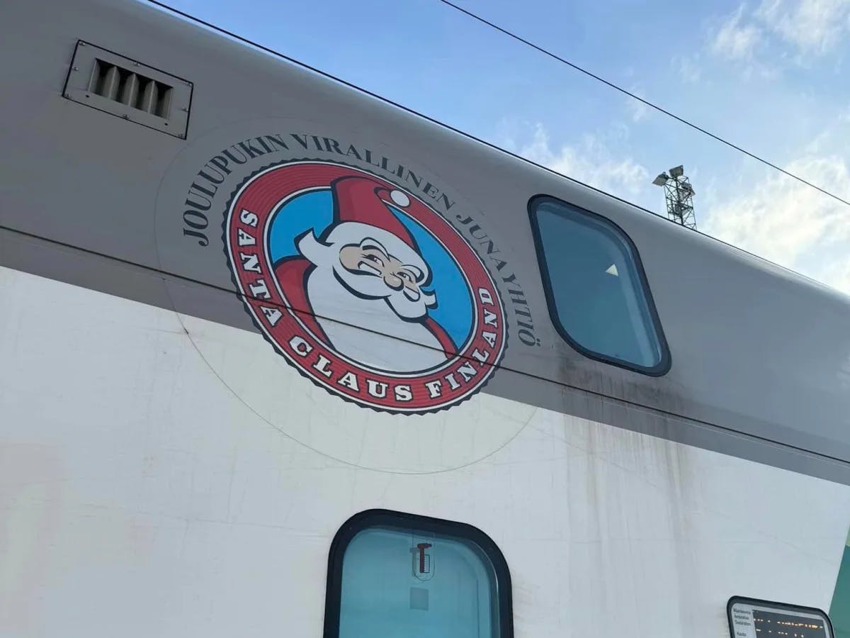 An image of Santa Claus on the outside of a train car. 