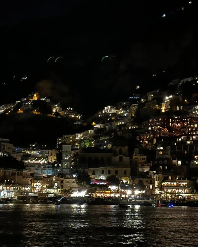 Picture of houses along water at night