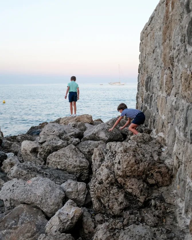 Children playing  on the rocks