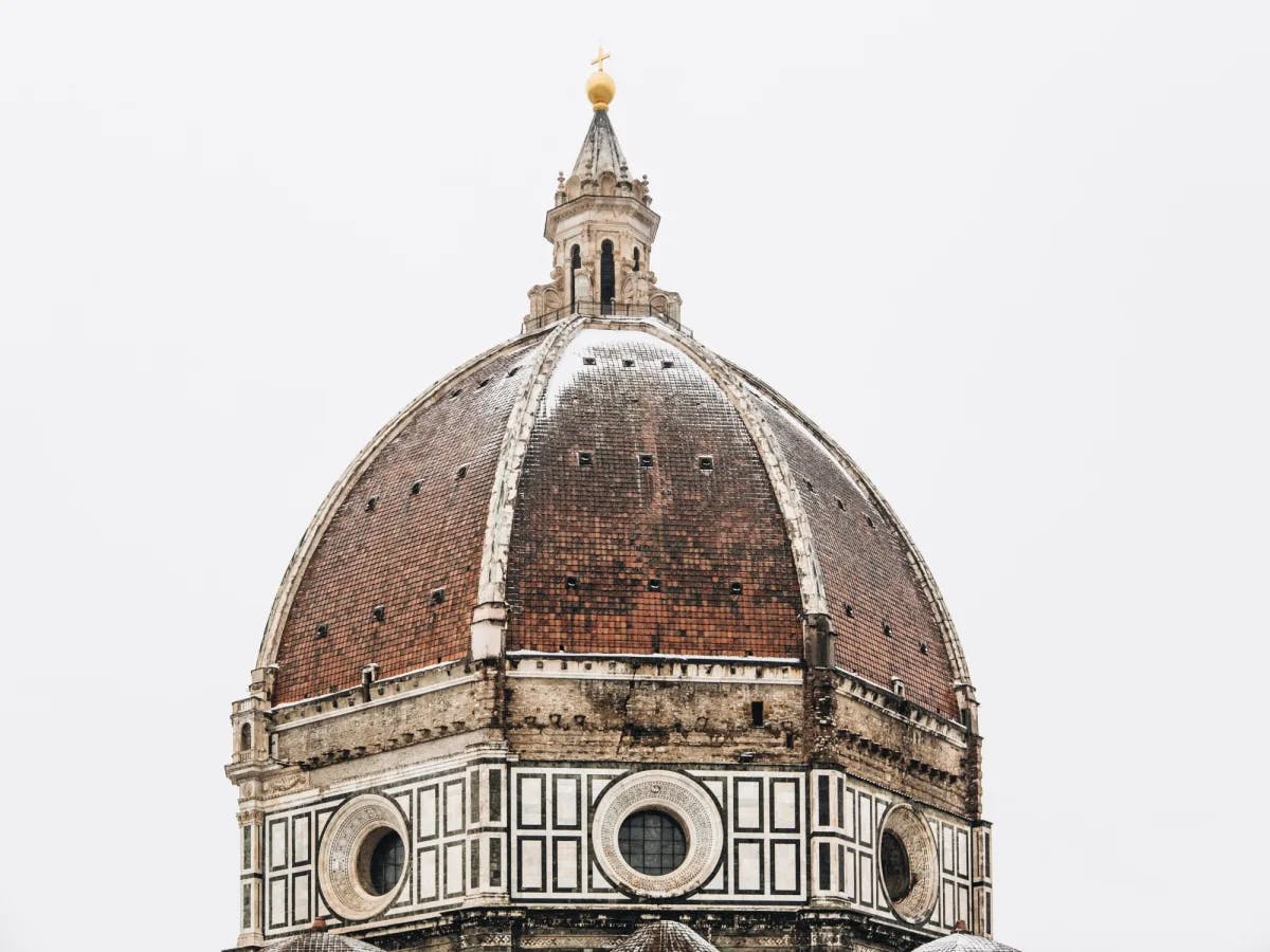 Brown and white dome of a Cathedral.