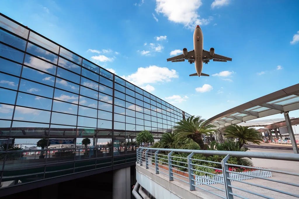 A plane taking off at Venice Marco Polo Airport (VCE), on a sunny day.