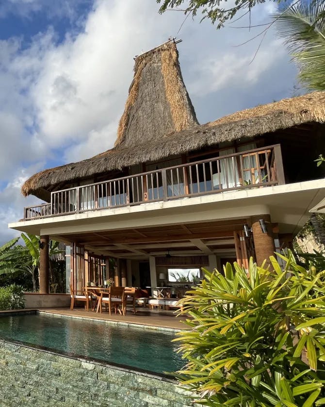 View of a beautiful private villa with swimming pool on a sunny day