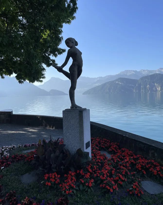 View of a statue under tree at evening