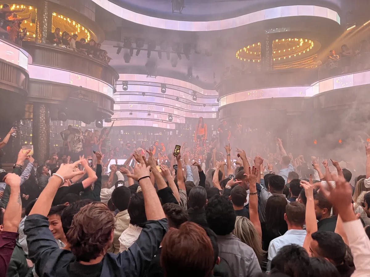 People enjoying an indoor concert.