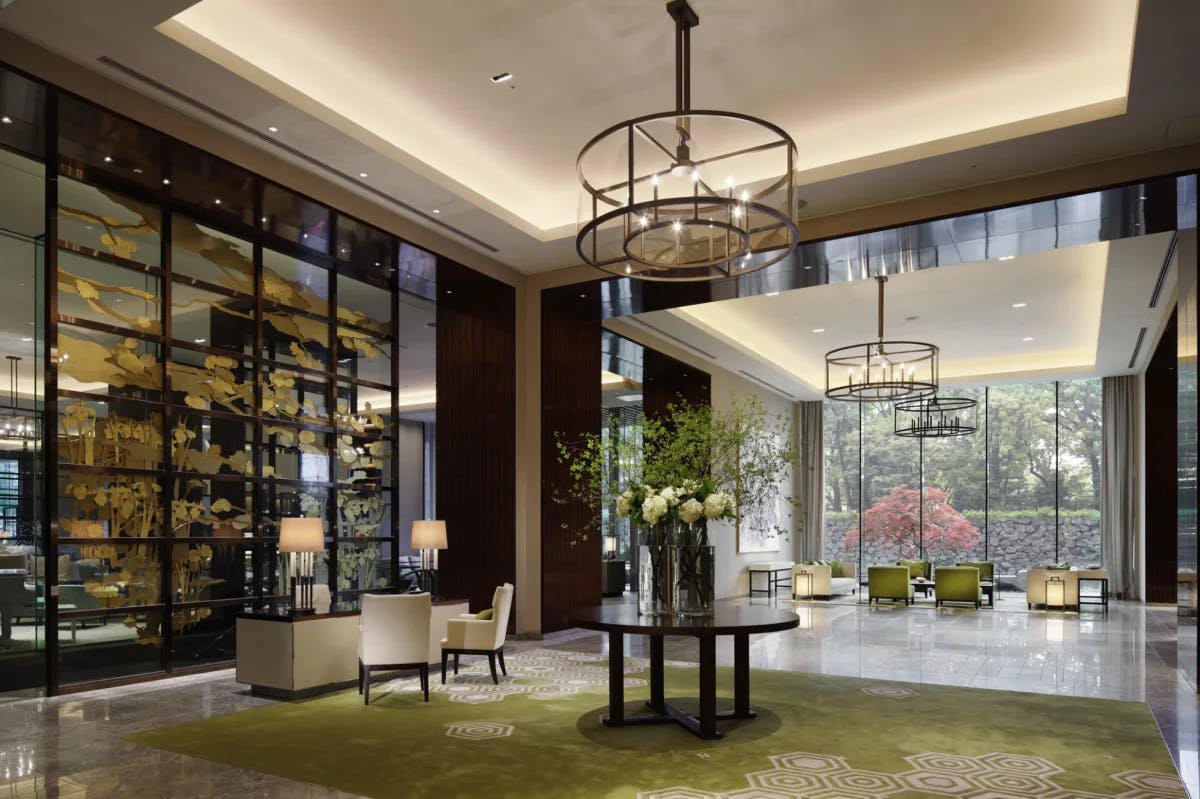 a fancy hotel lobby with floor-to-ceiling windows