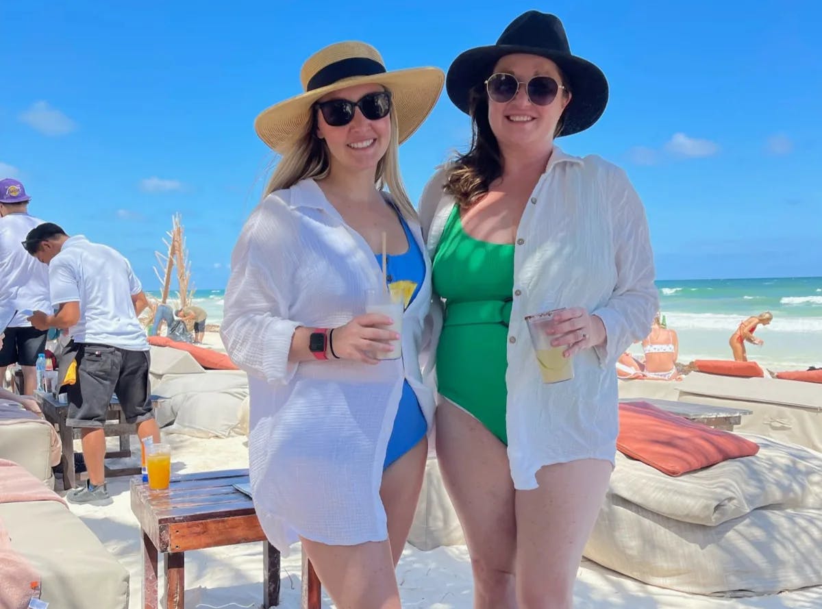 A picture of two females holding a glass at Mia Beach Club.