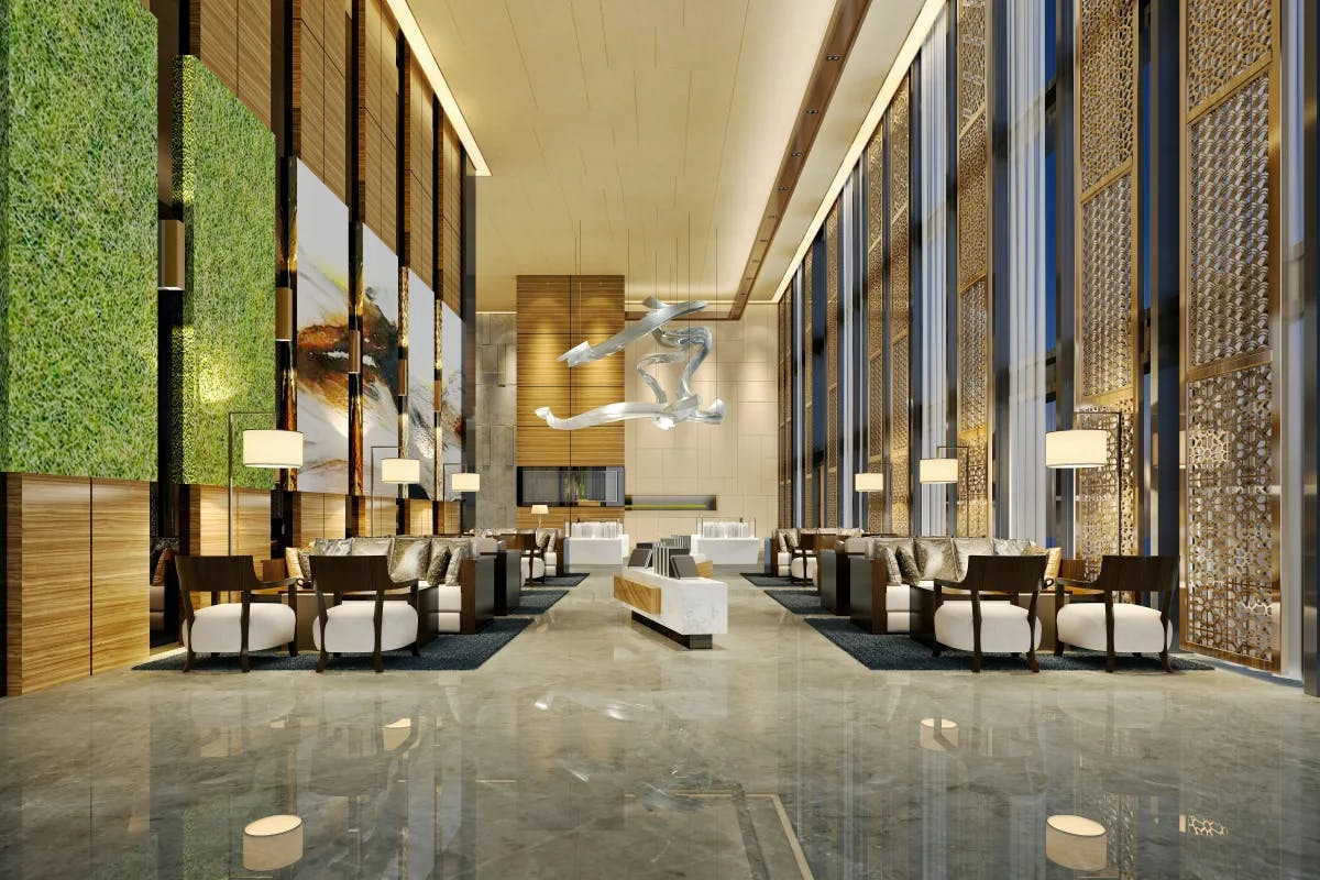 A picture of a hotel's lobby with white and brown furniture.