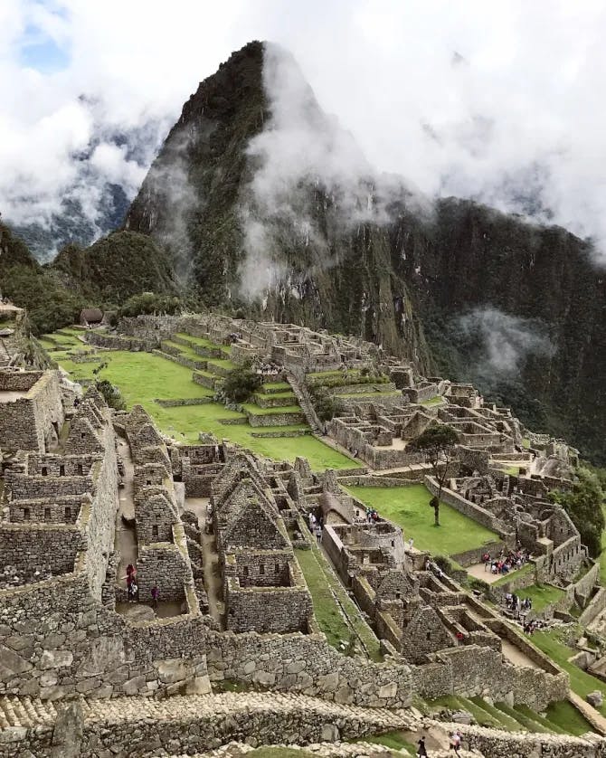 green valley with ancient ruins in it