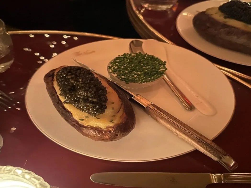 A picture of a food placed on a plate in a restaurant.