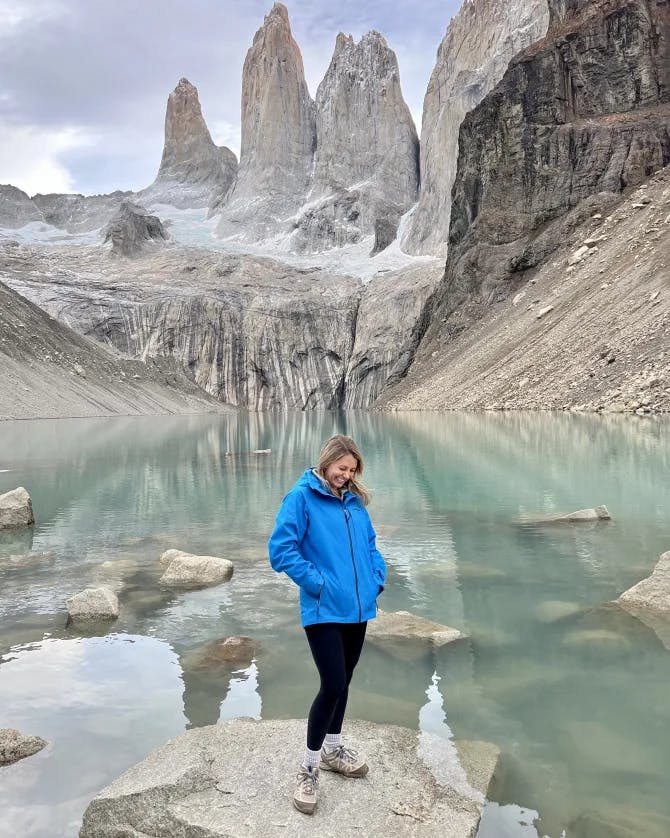 Picture of Mackenna standing on rock at Mirador Base Las Torres