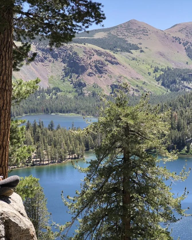 Travel advisor Carol sitting on a rock looking at the serene views of Mammoth Lakes