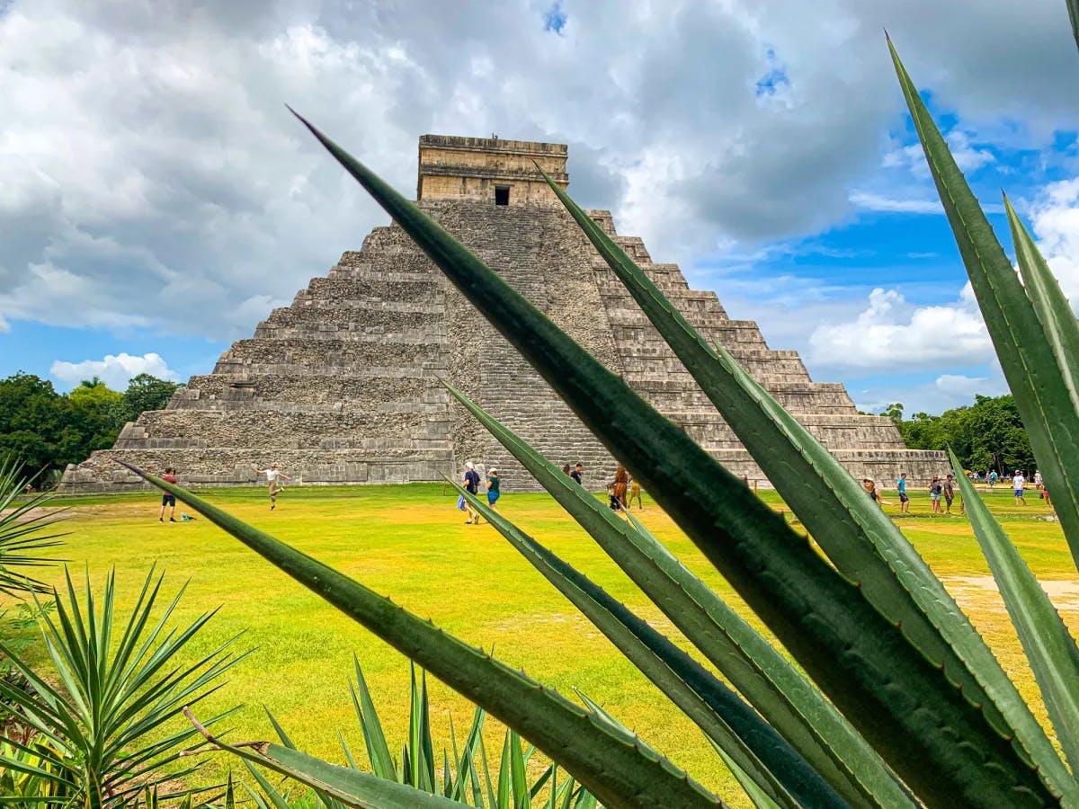 A triangular shaped landmark containing stairs leading to a small room on the top.