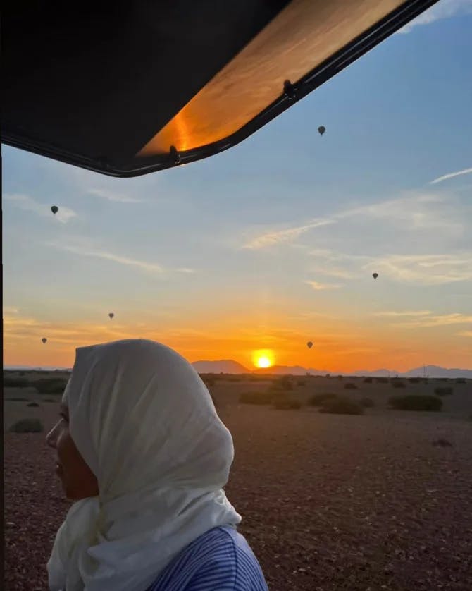 Travel advisor posing during sunset