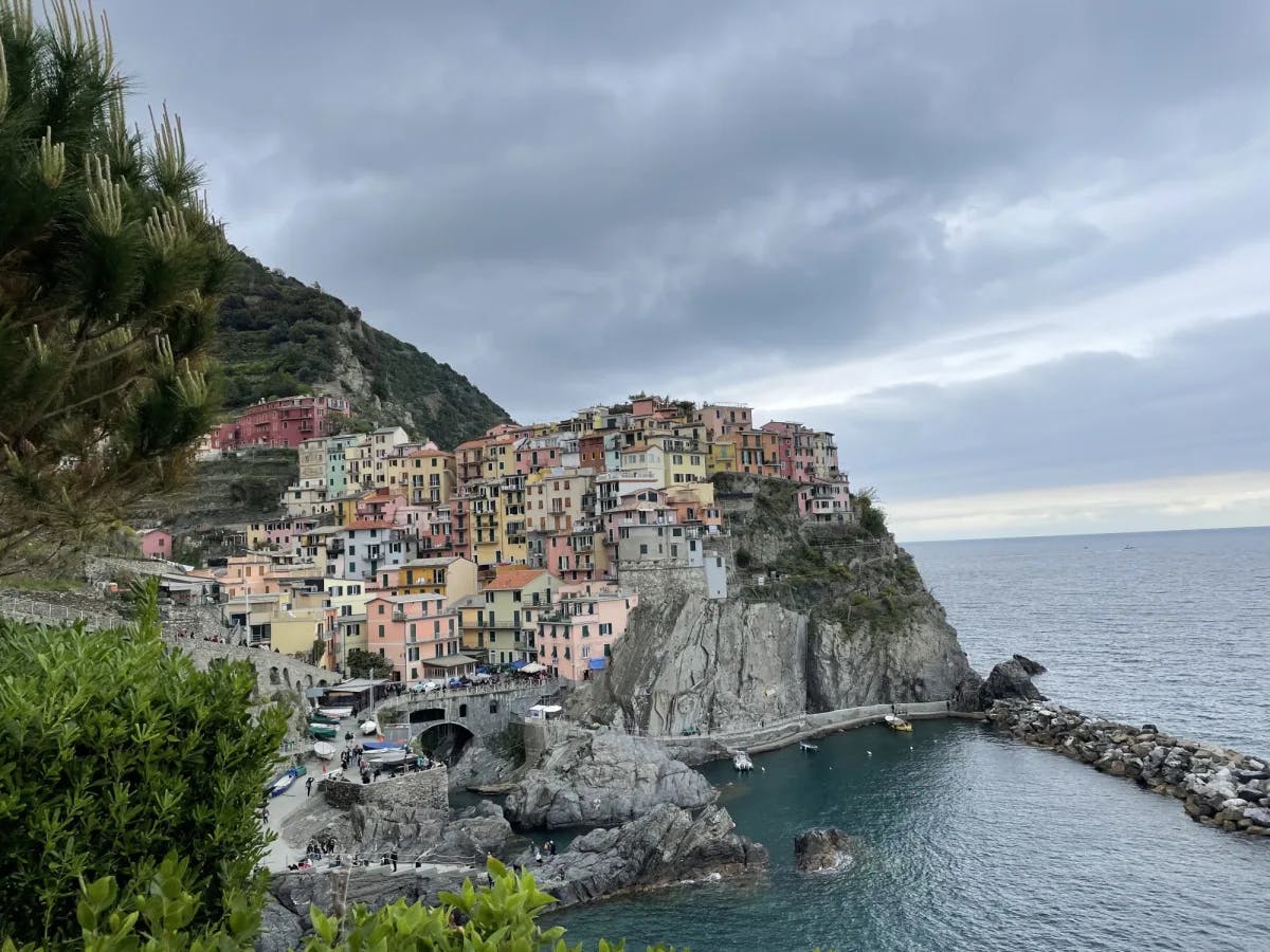 Colorful buildings in a town in Cinque Terre on a cliff by the ocean